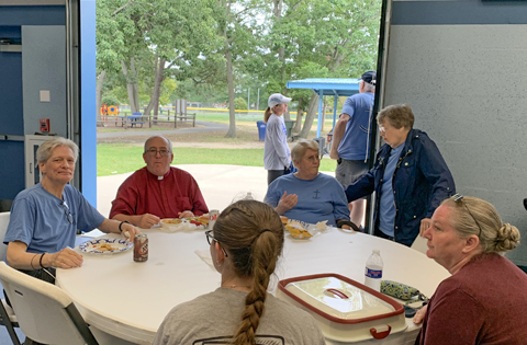 pastor and members enjoy picnic